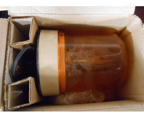 An amber vehicle hazard warning light with rotating beacon by P.M.G. Thorpe Ltd, England in original box