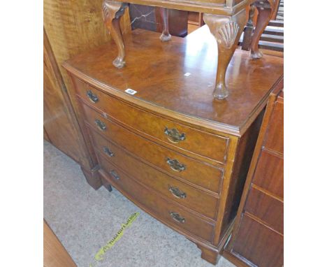 An 80cm reproction walnut bow front chest of four long graduated drawers, set on bracket feet