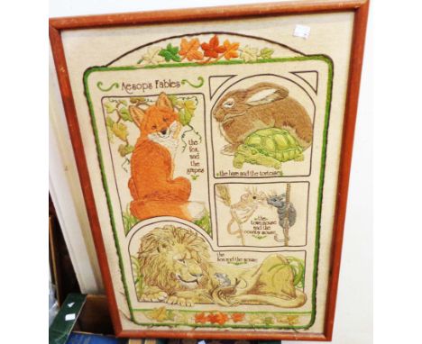 A framed embroidery panel, depicting animals from Aesop's Fables