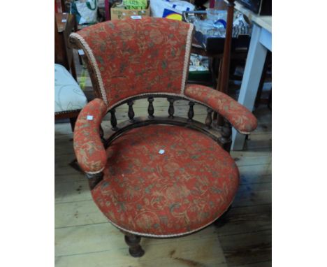 An Edwardian stained walnut and oak part show frame tub elbow chair with floral scroll tapestry upholstery, set on turned fro
