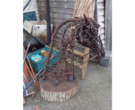 Richard Dawson Hewitt: a large metal and driftwood horse head sculpture made from found items including a heavy chain mane, s