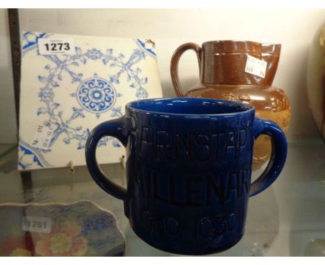 A Doulton Lambeth salt galzed stoneware harvest jug, a C.H. Branham, Barnstable two handled mug made to commemorate the Mille