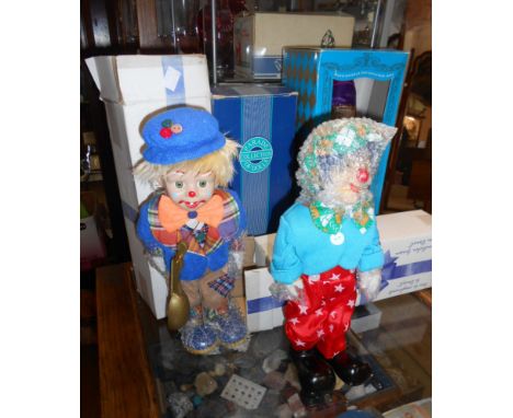 Four ceramic clown figurines comprising boxed World of Clowns example, musical clown and two others