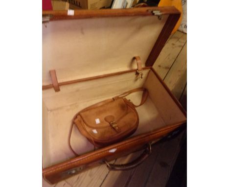 An old leather suitcase with brass locks - sold with a leather Sandringham handbag