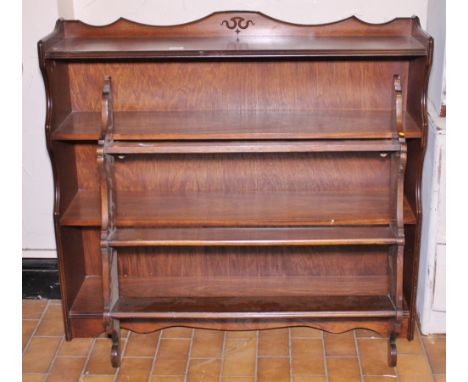 OAK BOOKCASE. Oak three shelf bookcase and a mahogany wall hanging shelf