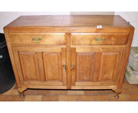 LIGHT OAK SIDEBOARD. Light oak sideboard on cabriole supports with two drawers over two cupboards 116 x 86cm