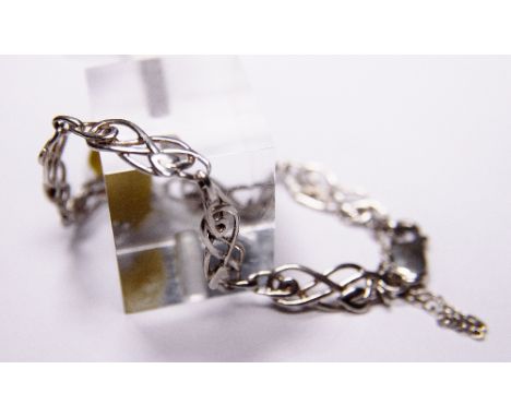 SILVER BRACELET. Sterling silver Celtic tulip bracelet with safety chain