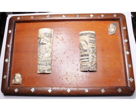 ORIENTAL IVORY CARVINGS. Antique Oriental ivory carvings mounted on mother of pearl inlaid frames