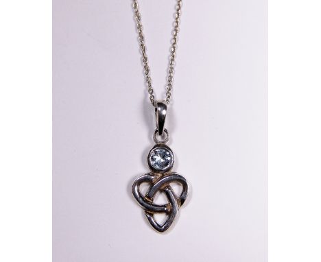 SILVER CELTIC PENDANT ON NECKLACE. Sterling silver blue topaz set Celtic pendant on sterling silver necklace