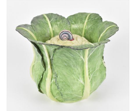 A large studio ceramic trompe l'oeil pot, realistically rendered as a cauliflower in its leaf, the lid with snail finial, the