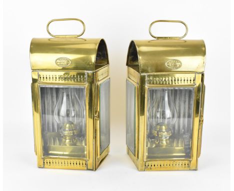 A pair of late Victorian ship's brass oil lanterns by Davey &amp; Co. , with single door enclosing a burner with baluster sha