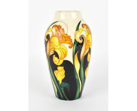 A Moorcroft pottery trial vase in a spring daffodil pattern, with tubelined blooms and leaves on a cream ground, the undersid