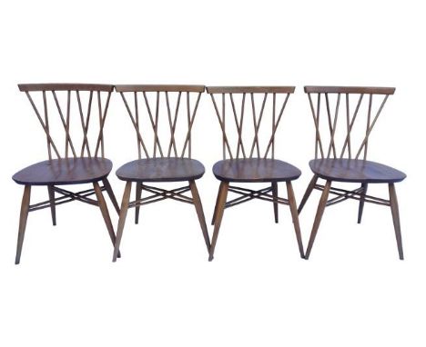 A set of four Ercol beech and elm candlestick dining chairs, model 376, each on tapering legs joined by X-cross stretchers, s