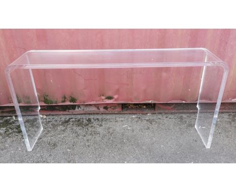 A long Perspex console table, 80 cm high x 147 cm wide x 30.5 cm deepProvenance: Contents of the Estate of Sir Frank Williams