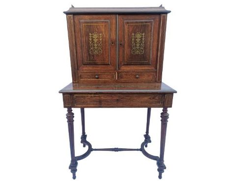 A Victorian brass inlaid mahogany ladies' bonheur du jour, the top fitted with a twin door cabinet inlaid with brass to the f