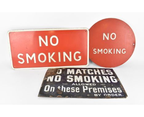 Three vintage 'No Smoking' enamel signs, one red and white, the other in blue enamel with white lettering reading 'No Matches