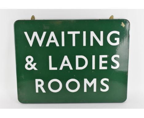 A Vintage enamel station sign 'WAITING AND LADIES ROOM', in green enamel with white lettering, 46.5 cm x 60 cm 