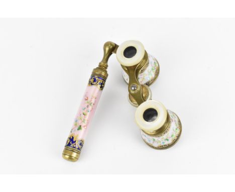 A pair of Belle Epoque enamel, brass and other of pearl opera glasses, with handle, with floral garlands on a pink, gilt and 