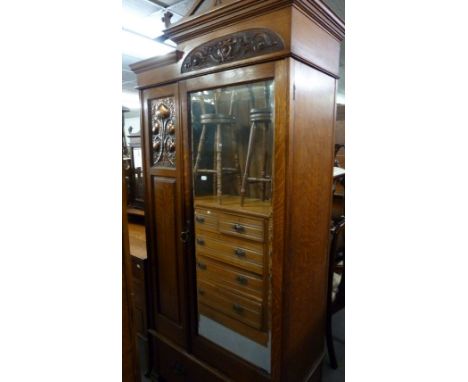 A GOOD QUALITY, SMALL EARLY TWENTIETH CENTURY CARVED OAK ART NOUVEAU DESIGN TOP TOP MIRROR DOOR WARDROBE, INCORPORATING STYLI