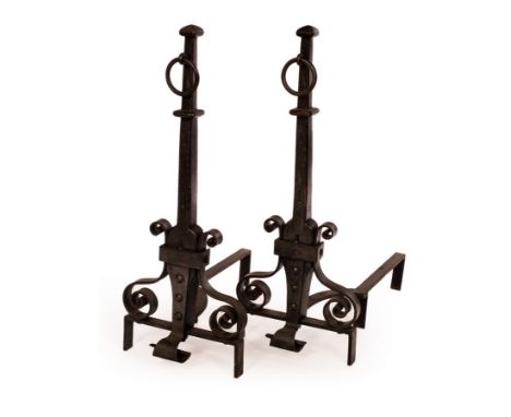 A pair of wrought iron fire dogs with ring handles over scroll supports, 93cm high/see illustration CONDITION REPORT: Conditi