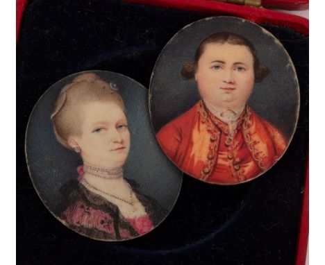 English School, Late 18th Century/Portrait Miniature of a Lady and Gentleman/she wearing a lace lined red dress and necklace,