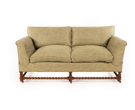 A Howard & Sons Victorian two-seat sofa, the drop ends with adjustable heights, on barley twist supports joined by stretchers