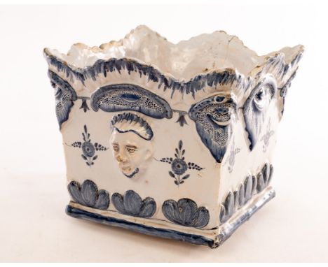 A Delft square planter with moulded mask heads to the sides and foliate decoration, 20cm high CONDITION REPORT: Second half o