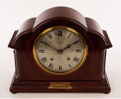An Edwardian mahogany eight-day mantel clock in an arch top case, 27cm high CONDITION REPORT: Pendulum missing, not on workin
