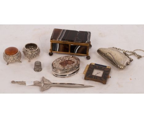 A Cartier alarm clock, the frame with Roman numerals in blue enamel, the stand loose, 5cm wide, a damaged agate casket, 9cm w
