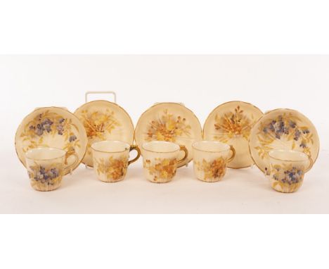 Five Royal Worcester cups and saucers of ribbed form with gilt borders painted sprays of violets and other flowers CONDITION 