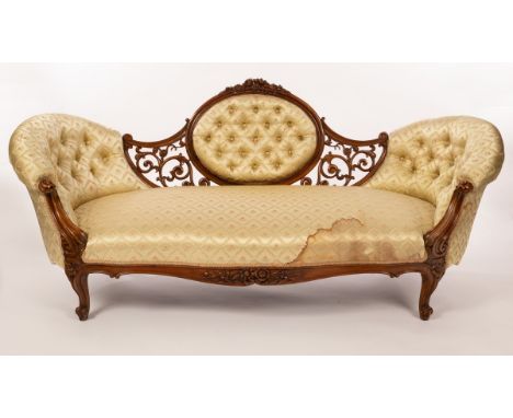 A Victorian two-chair back sofa, deep buttoned with oval back and pierced scroll surround, on moulded cabriole legs, 184cm wi