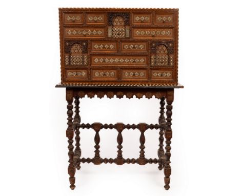 A 17th Century Hispano-Moresque bone inlaid cabinet, with thirteen various sized drawers and three deep drawers carved with I