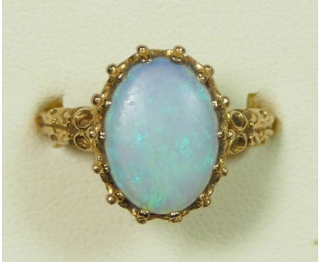 A 9ct gold dark opal and diamond dress ring, 19 x 10mm, ornate mount, P 1/2, 4.8gm 