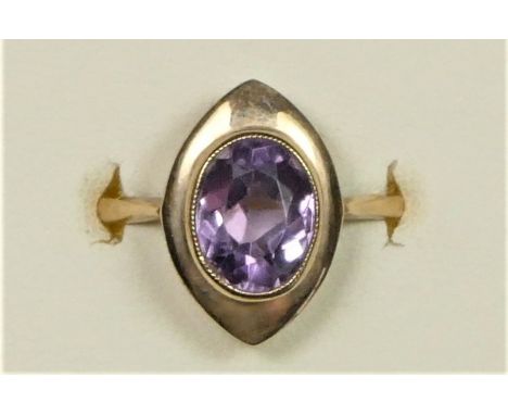 A 9ct rose gold and amethyst dress ring, milligrain collet set with a mixed cut stone, Q, 3.5gm 