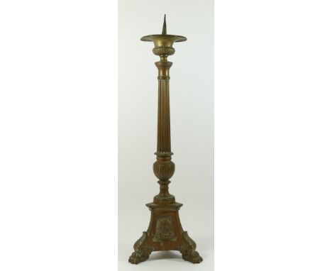 A 19th century church altar pricket candlestick, impressed panels depicting Jesus, Mary and Sacred Hearts, standing on claw f