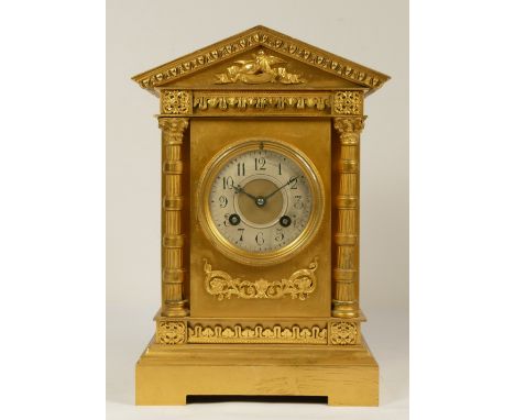 Martie et Cie, Paris, a late 19th century French gilt brass mantel clock, silvered chapter ring, architectural case, the move