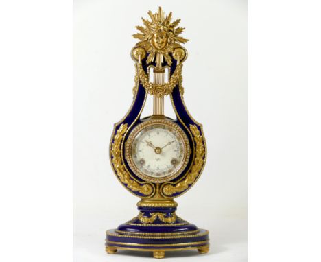 Franklin Mint for the V & A Museum, a cobalt blue and gilt Marie Antoinette 18th century style lyre mantle clock, the 8cm dia