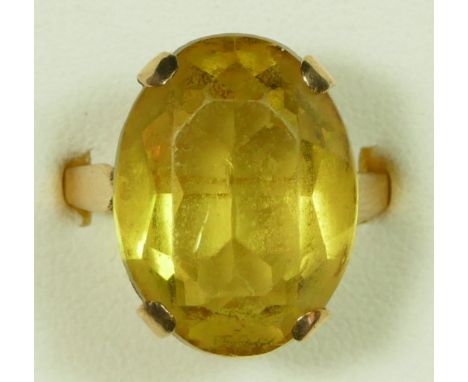 A 9ct gold citrine ring, Birmingham 1968, claw set with an oval mixed cut stone, 18 x 14mm, R, 6.5gm 