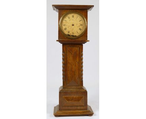 A late 19th Century oak miniature longcase clock, by X.L the movement by Hamburg American Clock Company, key. 