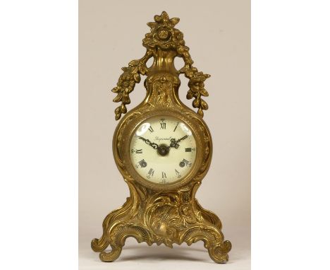 An Italian brass 8 day Louis XIV style mantel clock, with basket of flowers surmount, German Franz Hermle movement striking o