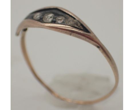 Georgian yellow metal ring set with three white stones  CONDITION REPORT: shaft is split 