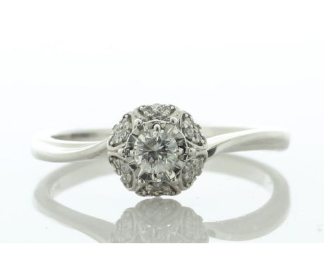 A flower setting, with one round brilliant cut diamonds in the centre surrounded by a halo of six petals, each with four roun