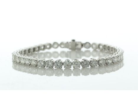 Forty round brilliant cut diamonds are set in this stunning 18ct white gold tennis bracelet. 7 inches in length. Item Specifi