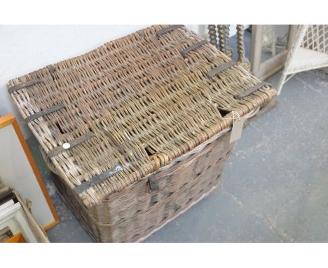 A Vintage wicker laundry basket.