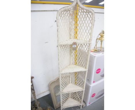 A Wicker freestanding corner shelf and a painted mirror. (2)