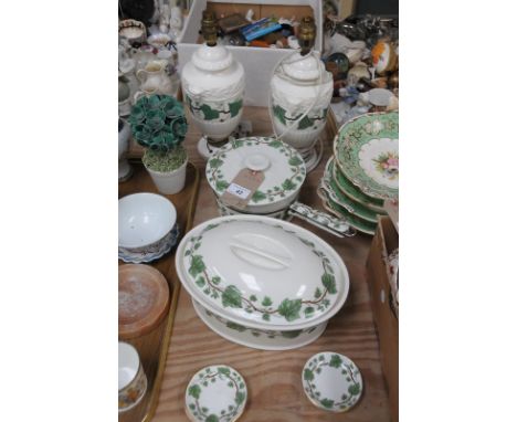 A French porcelaineous ivy leaf pattern saucepan and cover , stamped Asprey London and a matching casserole dish and cover, a