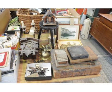 A Twin weight cuckoo clock, plated candelabra, rustic stool, wall plaques, family bible, etc.