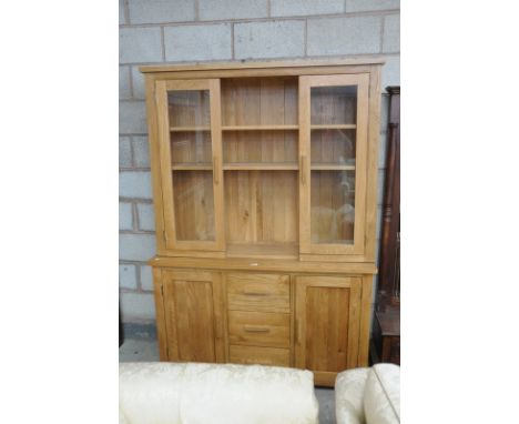 A Modern light oak dresser the high back with 2 glazed doors the base with an arrangement of 3 drawers and 2 cupboard doors.