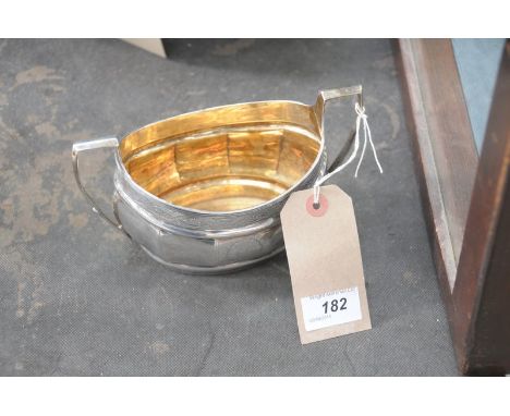 A 19th Century white metal 2 handled sugar basin with angular handles.