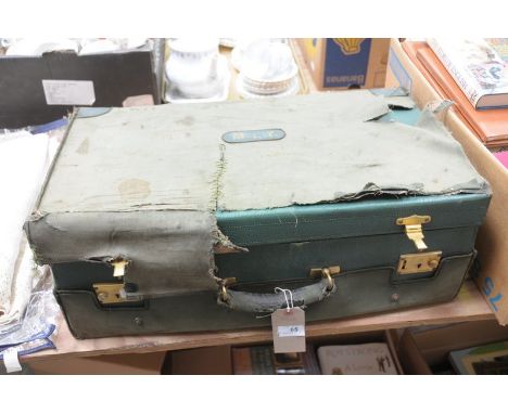 A Vintage silk lined leather travel case with a canvas outer case. 